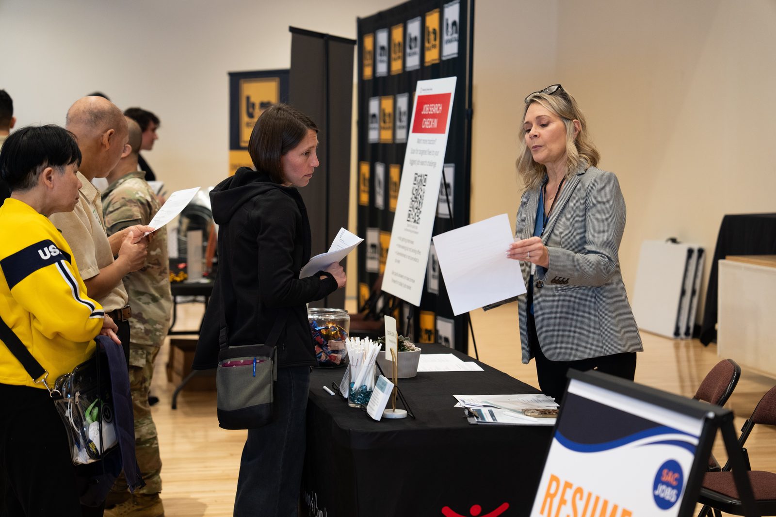 Job seeker getting resume help at SacJobs Career Fair